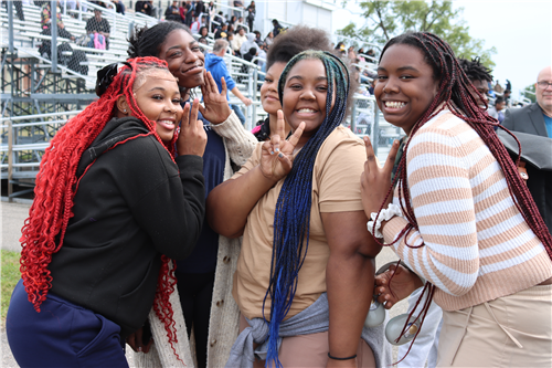 5 girls smiling in the picture
